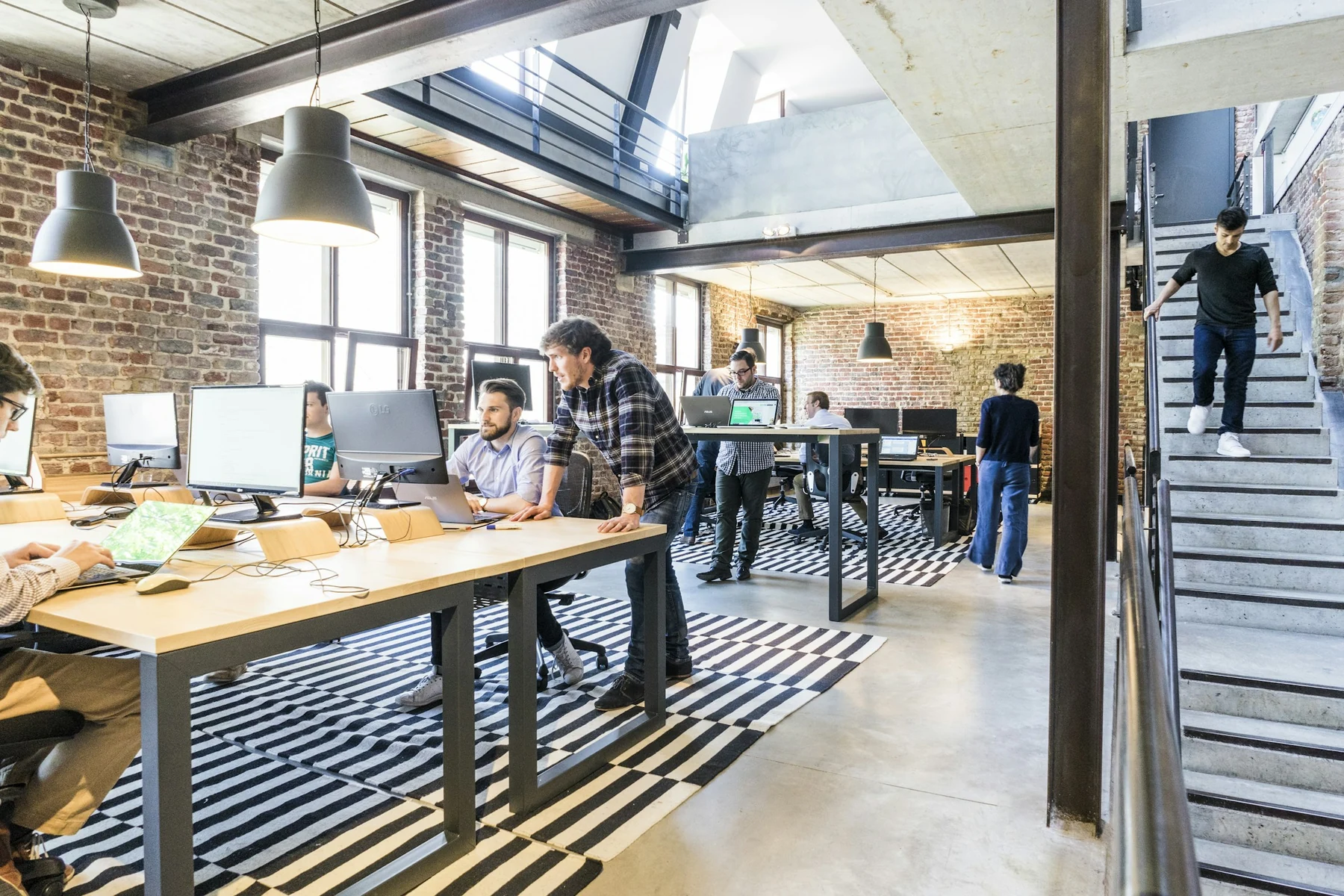 Colleagues working together in a bright, open-plan studio