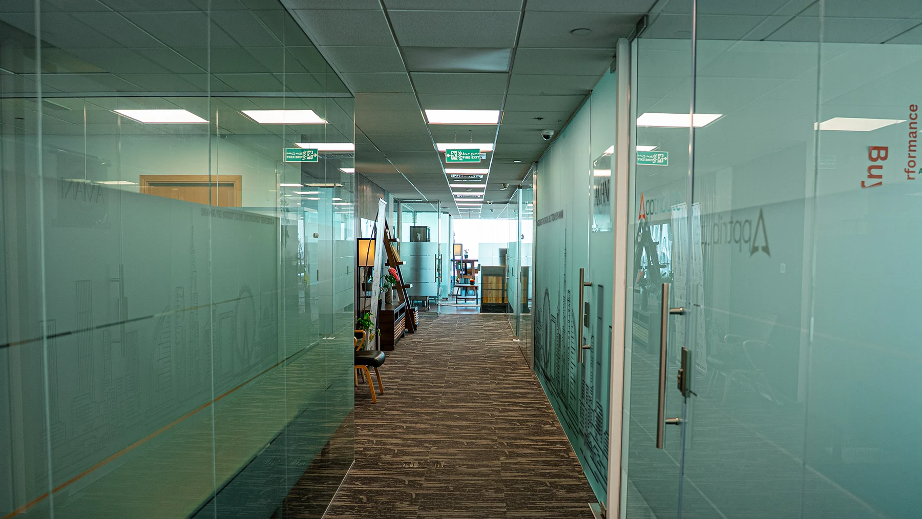 Glass-fronted offices along a corridor at Blacksea Business Center.
