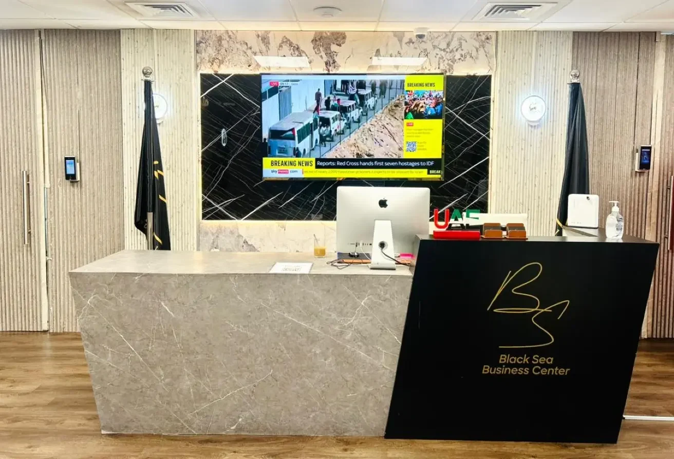 Reception desk and marble wall at Blacksea Business Center.