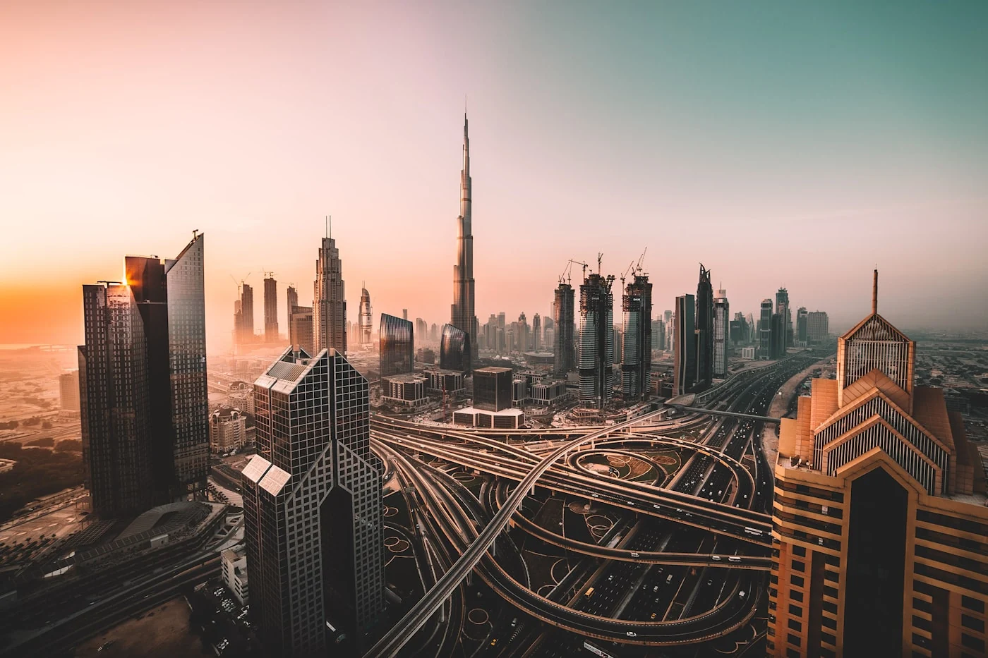 Dubai skyline and highway interchange in warm evening light